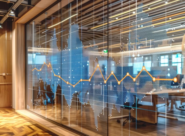 graphic chart displayed on glass wall in office building